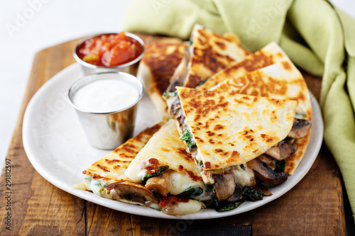 Mushroom and cheese quesadillas with sour cream and tomato salsa photo