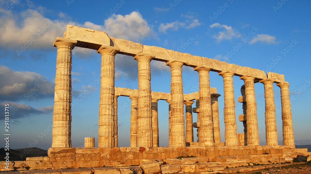 Ancient greek colonnade at sunset on deep blue sky background