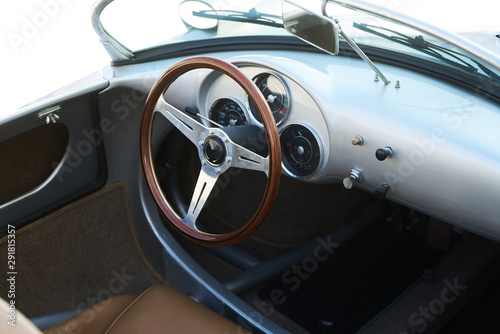 Vintage retro car interior, close-up. Old automobile steering wheel