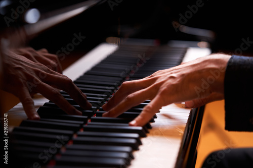 Closeup man's hand playing piano. Music performer's hand