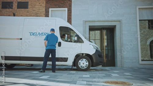 Courier Gets out of Delivery Truck, Takes out Postal Package and Man Gives it to Customer, Who Signs Electronic Signature POD Device. In Business District Courier Delivers Cardboard Box Parcel to Man  photo