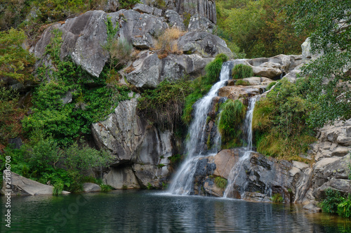 Fototapeta Naklejka Na Ścianę i Meble -  Waterfall at a natural spot called Poço Negro in Carvalhais, Sao Pedro do Sul, Portugal