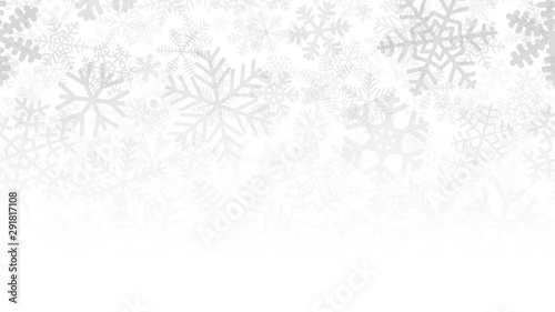 Christmas background of many layers of snowflakes of different shapes, sizes and transparency. Gradient from gray to white photo