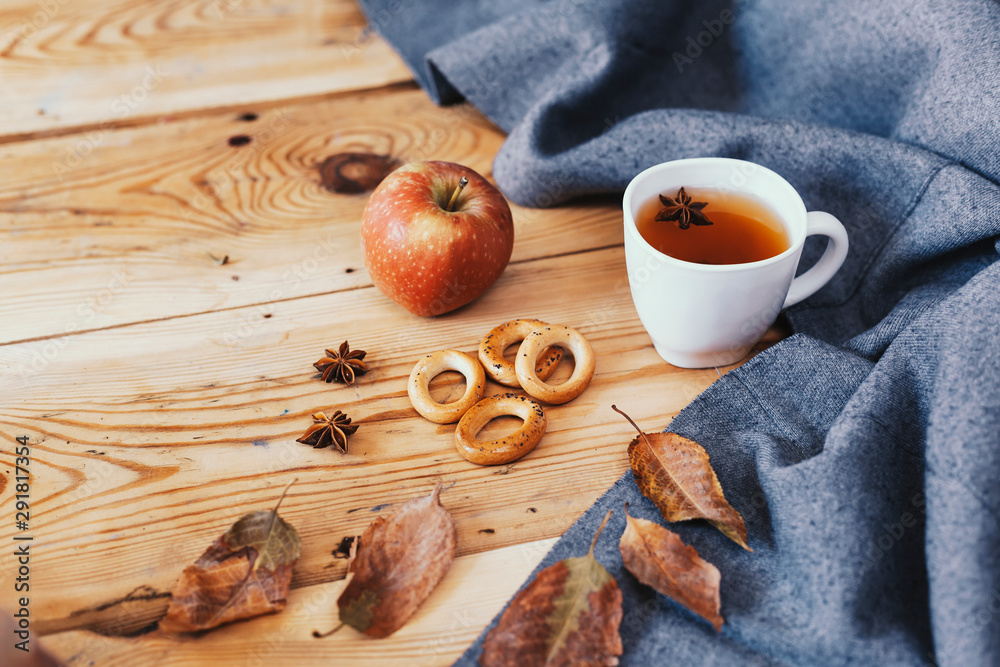 Autumnal mood. Sweet cookies and apples. Drinking hot tea in cold autumn days. Cold weekend at home.