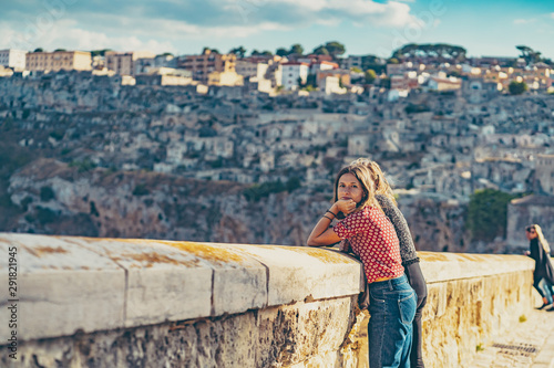 happy tourist travelling in south of italy, posing in a selfie photo in Matera, Basilicata, unesco site, capital of culture 2019