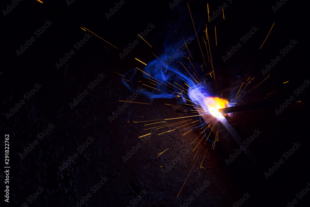 Weld Exploding Arc welding. Welding of two sheets of metal by electrode in inert gases ...