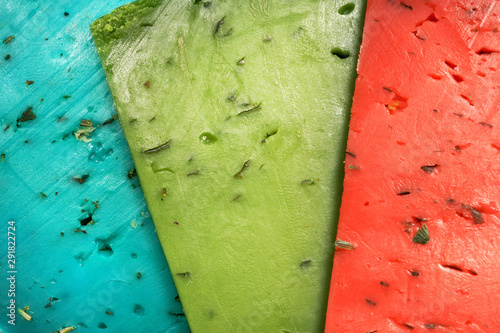 Cheese plate. Cheese on a white background. Dutch green, red and blue cheese. Lavender pesto, Basiron Pesto and Pesto Rosso on a white background.
