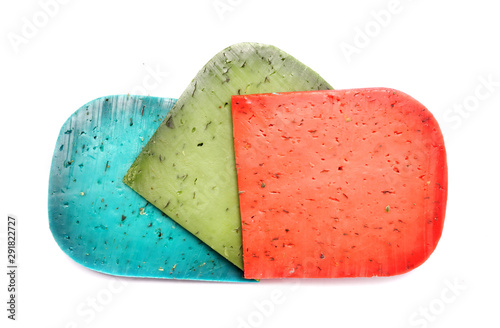 Cheese plate. Cheese on a white background. Dutch green, red and blue cheese. Lavender pesto, Basiron Pesto and Pesto Rosso on a white background.