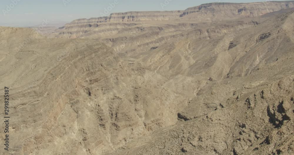 Aerial shot, day, high altitude view of desert mountain range, drone Aerial shot, day, high altitude view of desert mountain range, drone