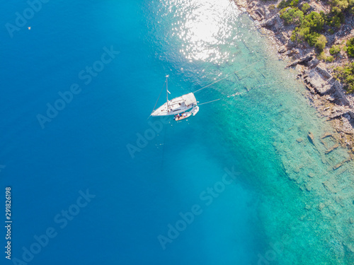 Sailing yacht moored to the shore, a delightful seascape drone photo.