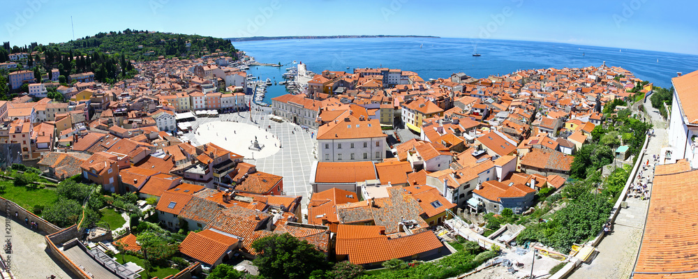 Panoramic aerial view of Piran old town and Gulf of Piran on Adriatic Sea, Slovenia. One of the three major towns of Slovenian Istria. Much medieval architecture with narrow streets and compact houses