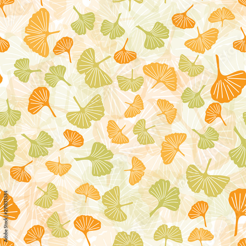 Endless pattern of large and small ginkgo leaves in green and yellow. Vector seamless pattern for textile, wrapping paper, decoration, etc. © Olga Neru