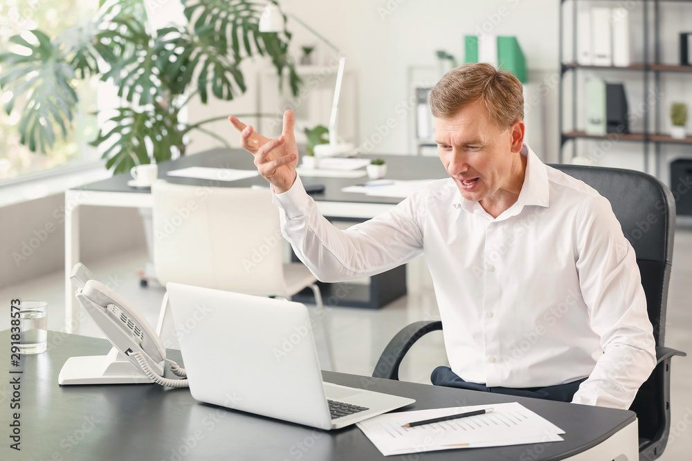 Portrait of stressed businessman in office Portrait of stressed businessman in office