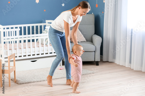 Mother teaching her little ...