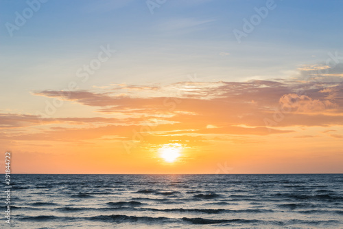 Fototapeta Naklejka Na Ścianę i Meble -  sunset sky over sea in the evening with beautiful sunlight