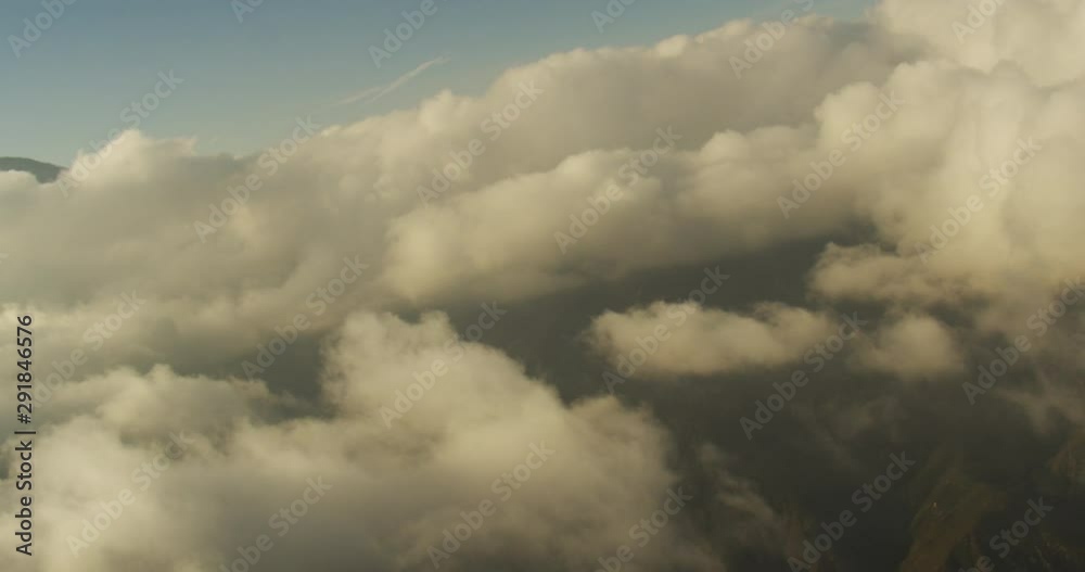 Aerial shot, day, pan right to show cloud grouping above california hills, drone Aerial shot, day, pan right to show cloud grouping above california hills, drone