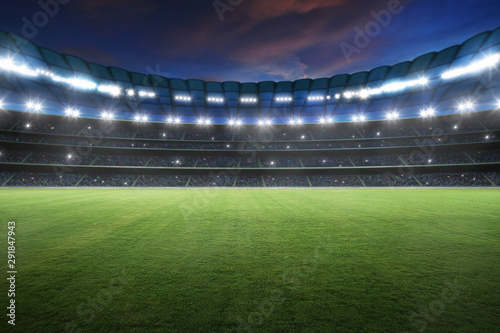 Stadium with spotlight and empty green grass. NIght scene .