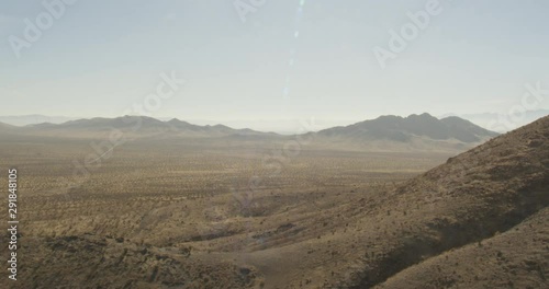 Helicopter aerial shot moving through hot desert, drone, helicopter aerial 