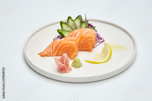 Salmon sashimi set in white plate on white background. Delicious Japanese sashimi set.