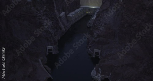 Helicopter aerial of massive dam, night, drone 