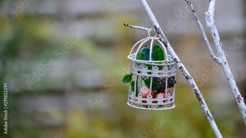  white decorative basket on a branch