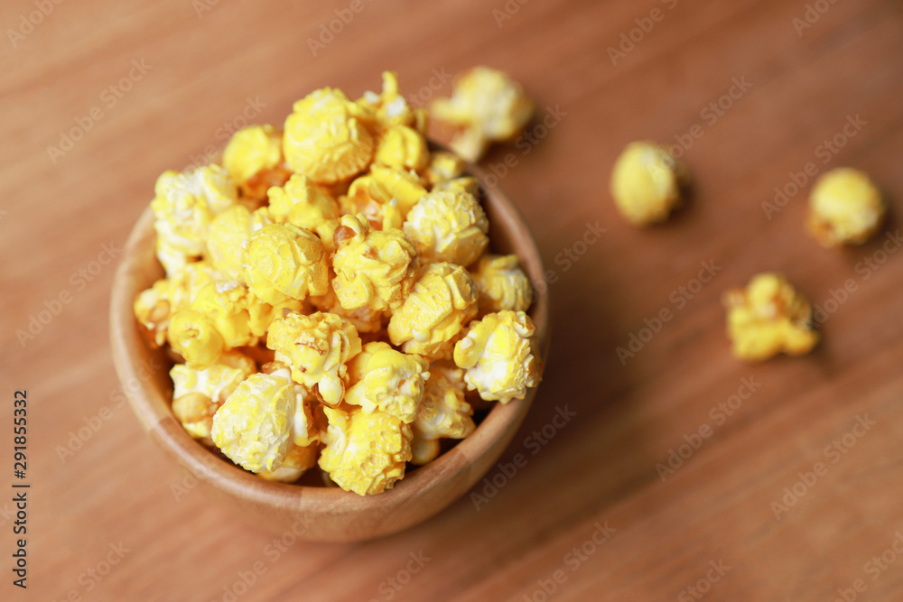 baked popcorn for eating in wooden bowl baked popcorn for eating in wooden bowl