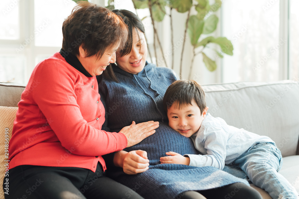 Grandmother, pregnant daughter and grandson at home Grandmother, pregnant daughter and grandson at home