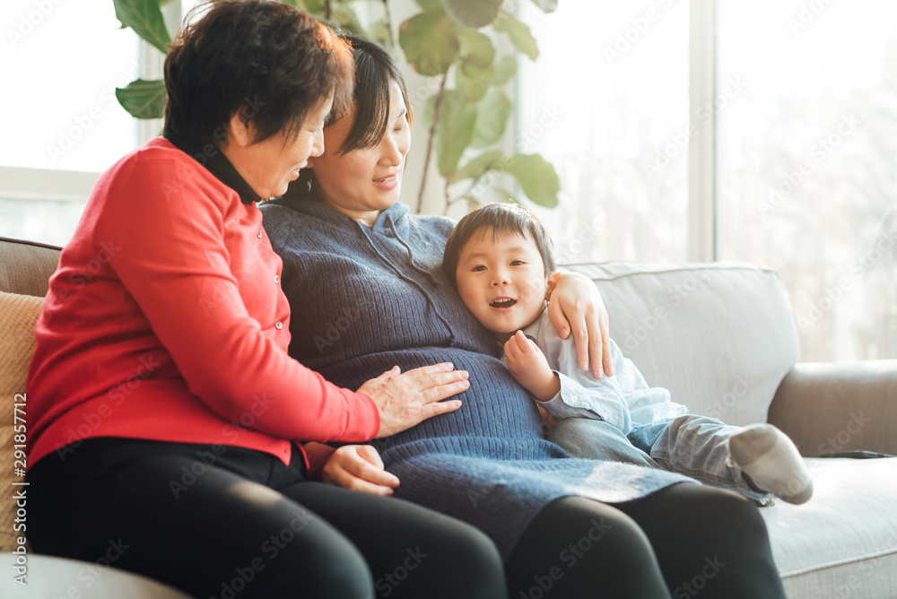 Grandmother, pregnant daughter and grandson at home Grandmother, pregnant daughter and grandson at home