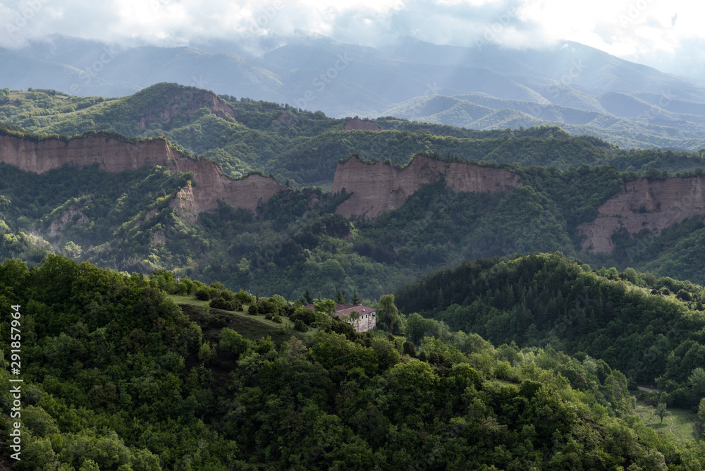 The Medieval Orthodox Monastery of Rozhen and Rozhen pyramids -a unique pyramid shaped mountains cliffs in Bulgaria, near Melnik town.