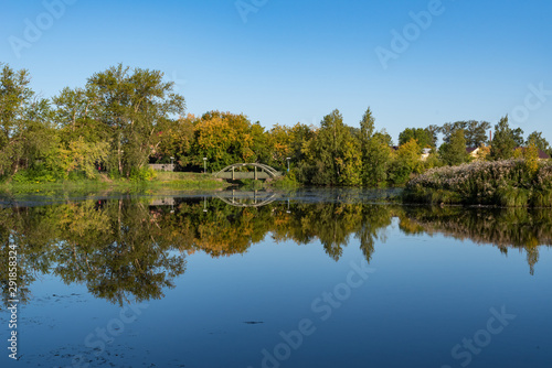 Zakharyevsky park, a bridge across the Tabora pond, next to Tikhvin Assumption (Bogorodichny Uspensky) Monastery. Leningrad region. Russia