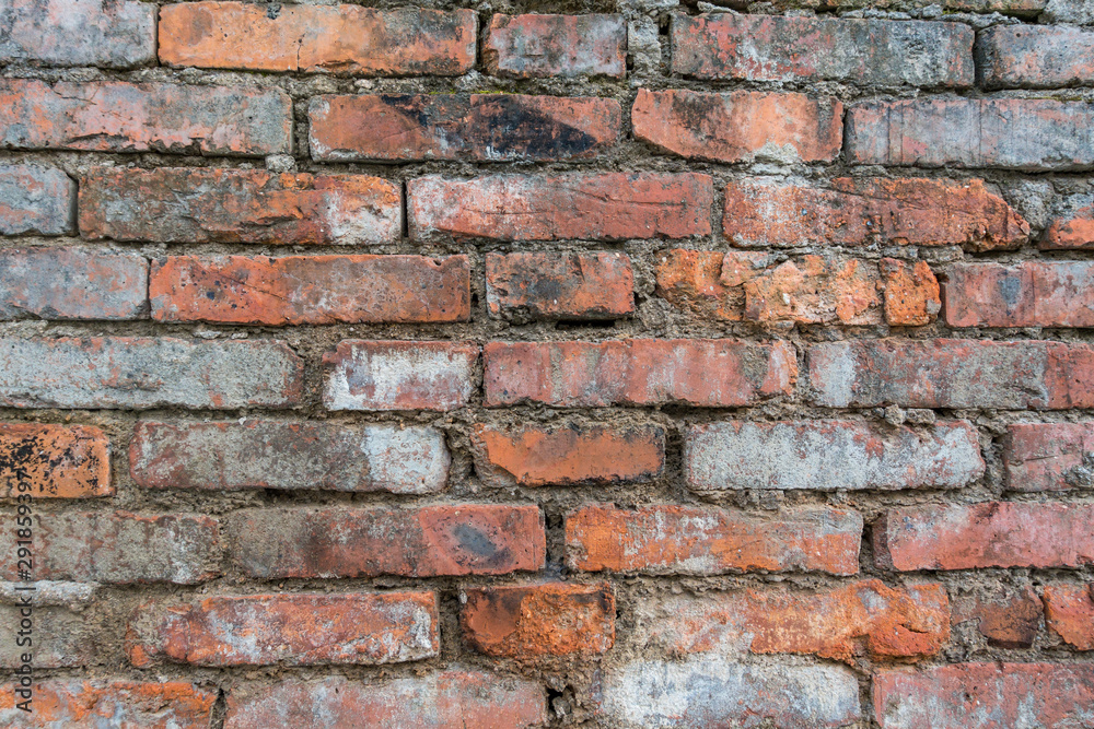 Naklejka premium rough orange brick wall texture background