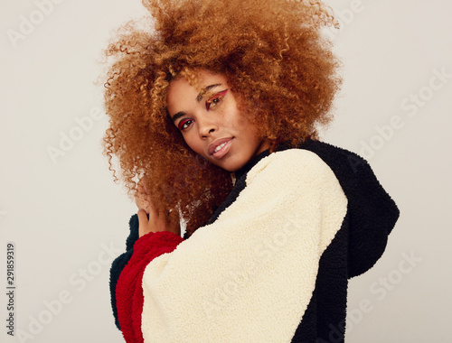 Gorgeous young afro woman portrait looking at camera photo