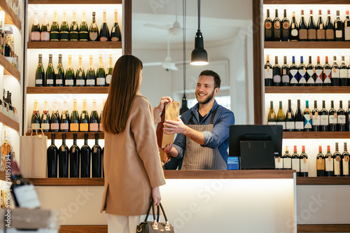 A Woman Buying a Wine at Winery