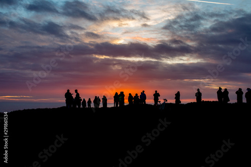 People gathering to watch the sunset photo