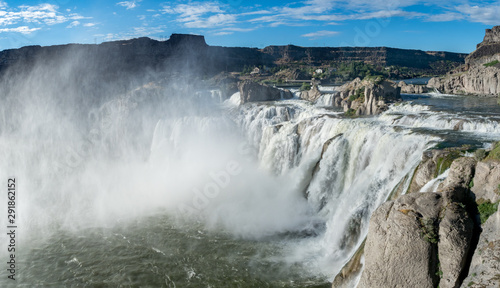 Shoshone Falls Park on bright  sunny summer day with mist and rainbow over falls  Twin Falls  Idaho  USA