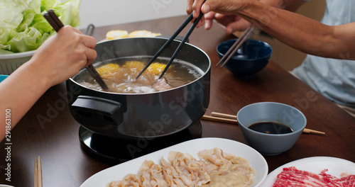 фотографія Chinese hot pot with family at home