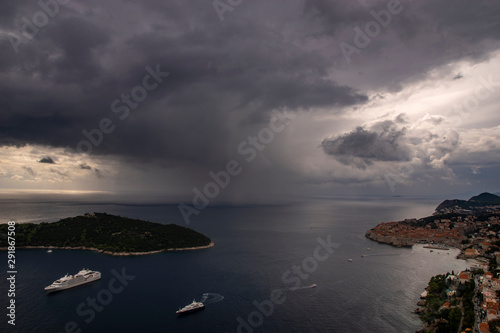 Fototapeta Naklejka Na Ścianę i Meble -  A huge downpour by the sea approaching Dubrovnik in Croatia