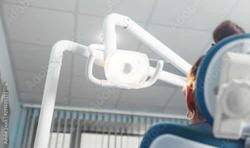 Woman sitting in a dental chair in the clinic.