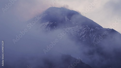 Time lapse of clouds moving through the forests and mountains photo