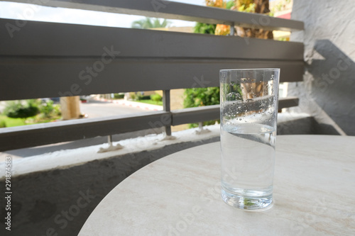 A glass of water on the balcony of the hotel room. Rest is all inclusive.