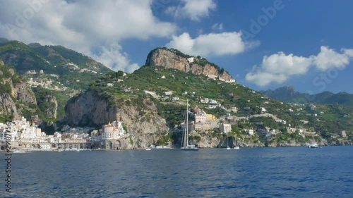 View from the moving ferry on Amalfy city and Amalfy Coast. Italy on August 16, 2019. photo