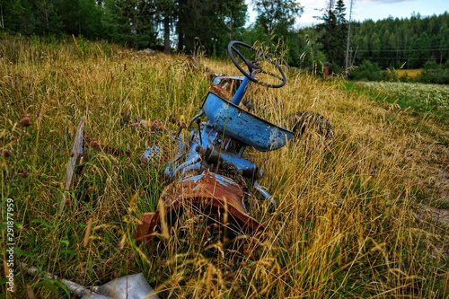 Abandoned old tractor in the field