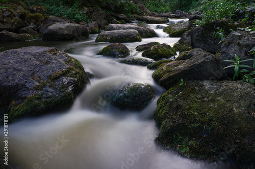 Water streaming in river in summer night
