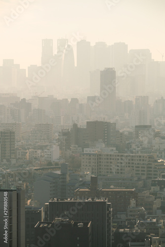 PM2.5 Unhealthy air pollution dust smoke in the urban city. Low visibility city view with dangerous haze and fog.