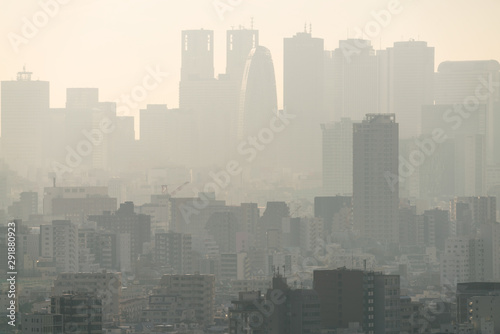 Fototapeta Naklejka Na Ścianę i Meble -  PM2.5 Unhealthy air pollution dust smoke in the urban city. Low visibility city view with dangerous haze and fog.
