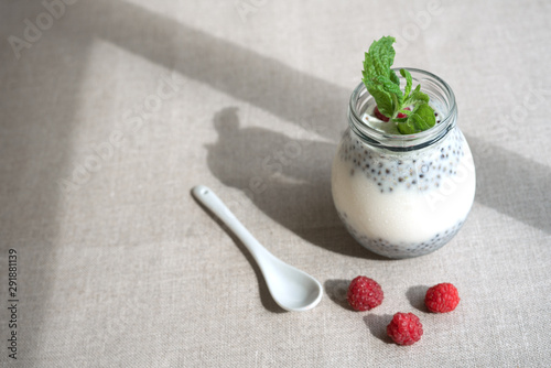 Healthy vanilla hemp pudding in a glass with fresh berries