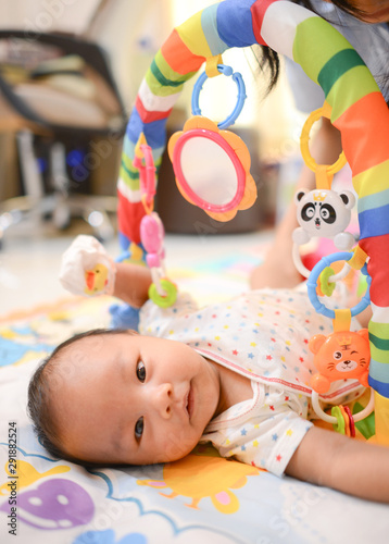 Cute little Asian baby playing Playgym photo