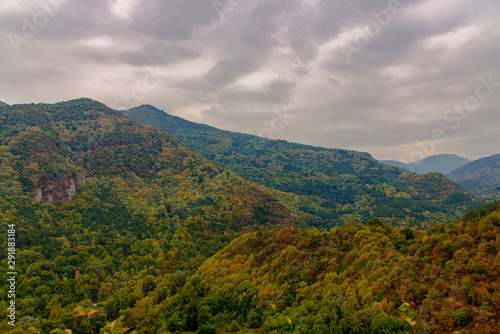 Autumn landscape view in Rhodope Mountains with green  yellow and orange leafs 