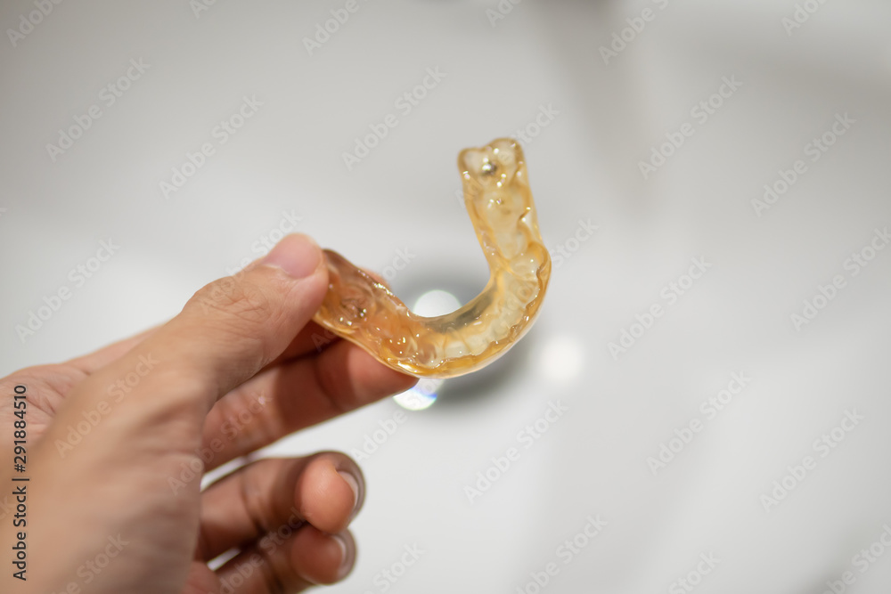 Fototapeta premium mouth guard for anti bruxism in men hand