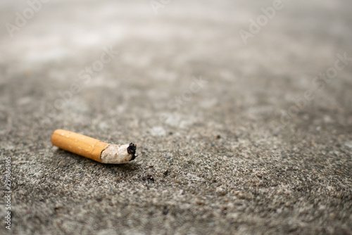 cigarette butt on concrete floor